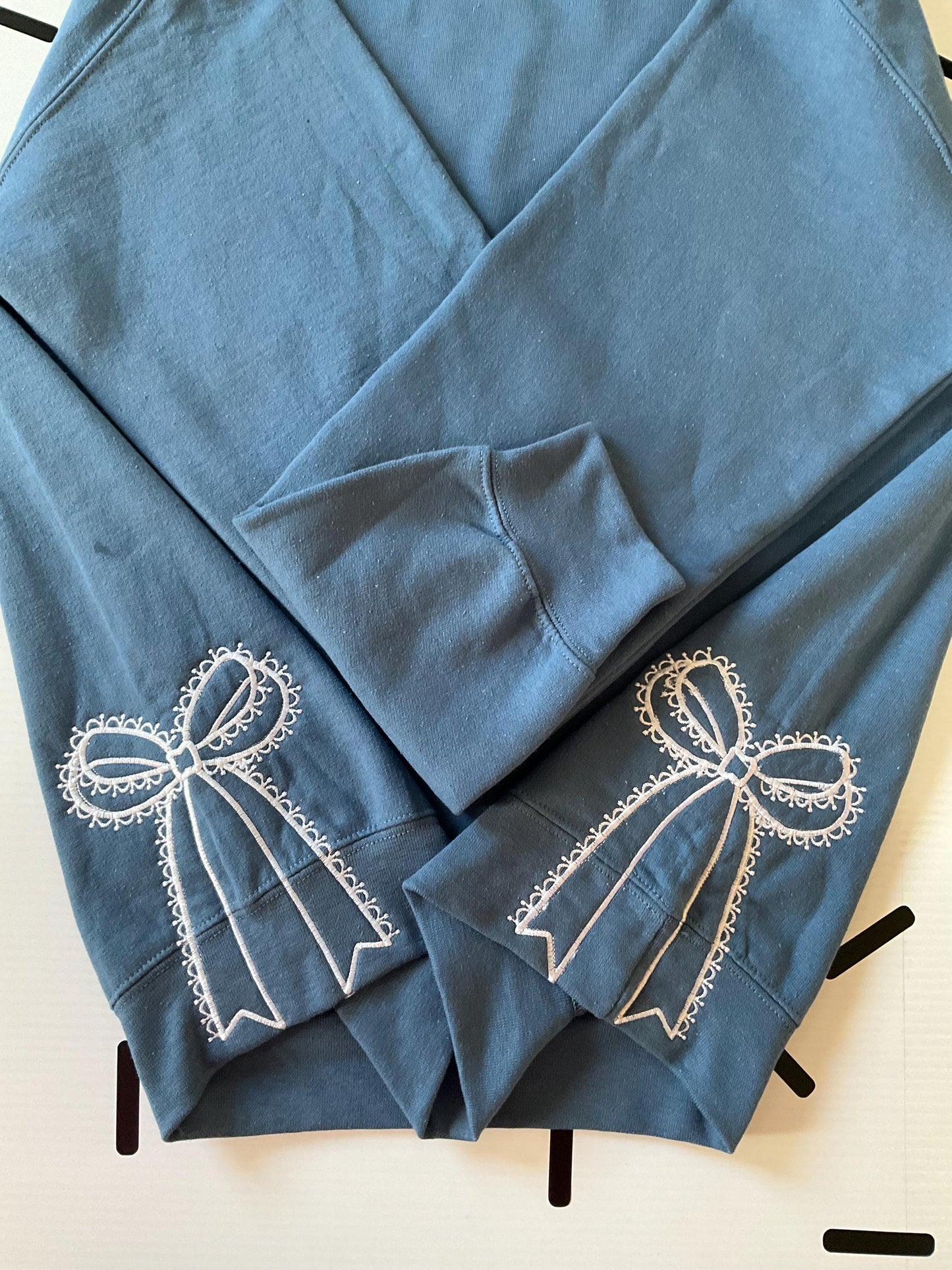 Embroidered Side Bow Sweatshirt: Classic Lace Design