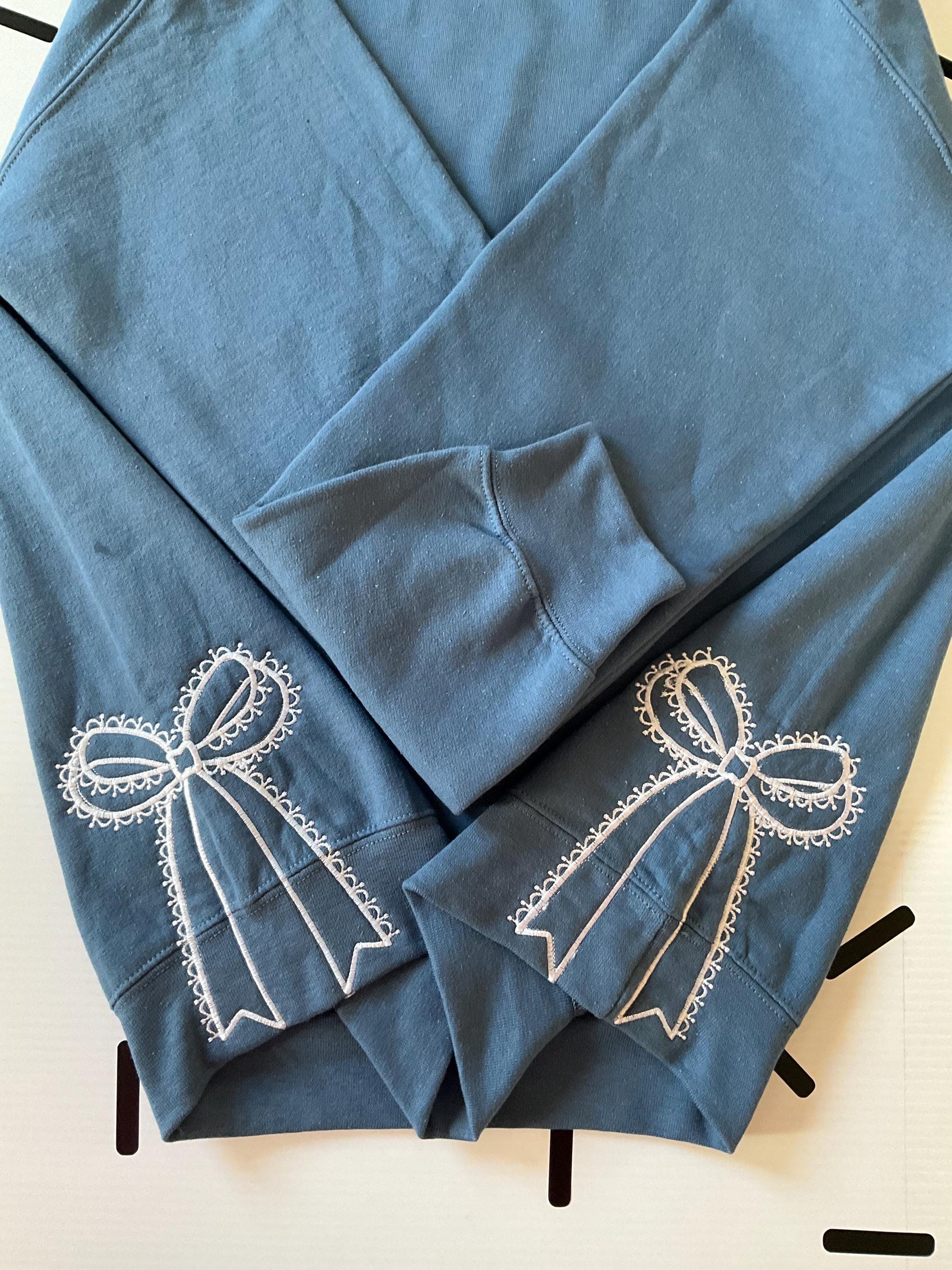 Embroidered Side Bow Sweatshirt: Classic Lace Design