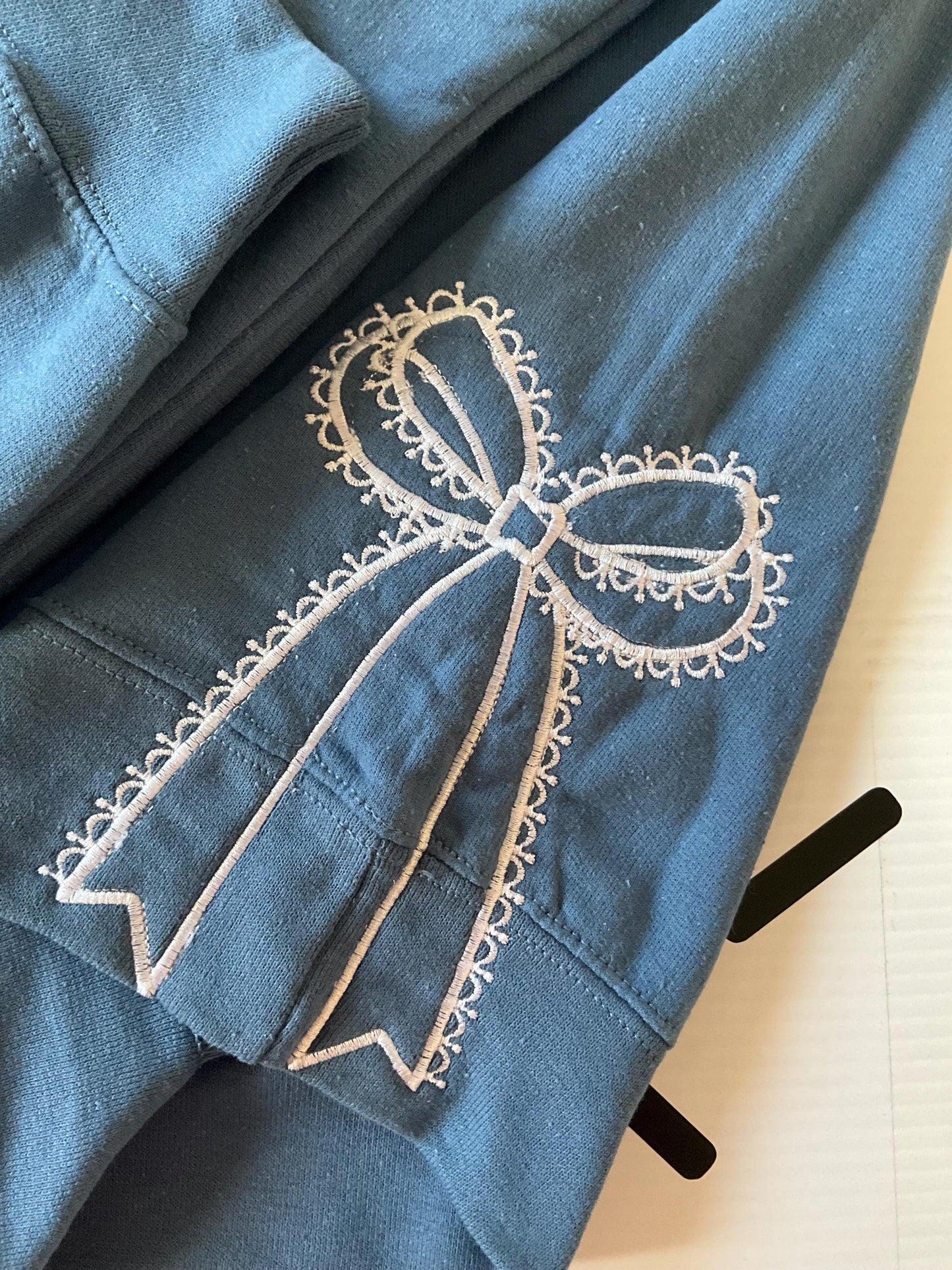 Embroidered Side Bow Sweatshirt: Classic Lace Design