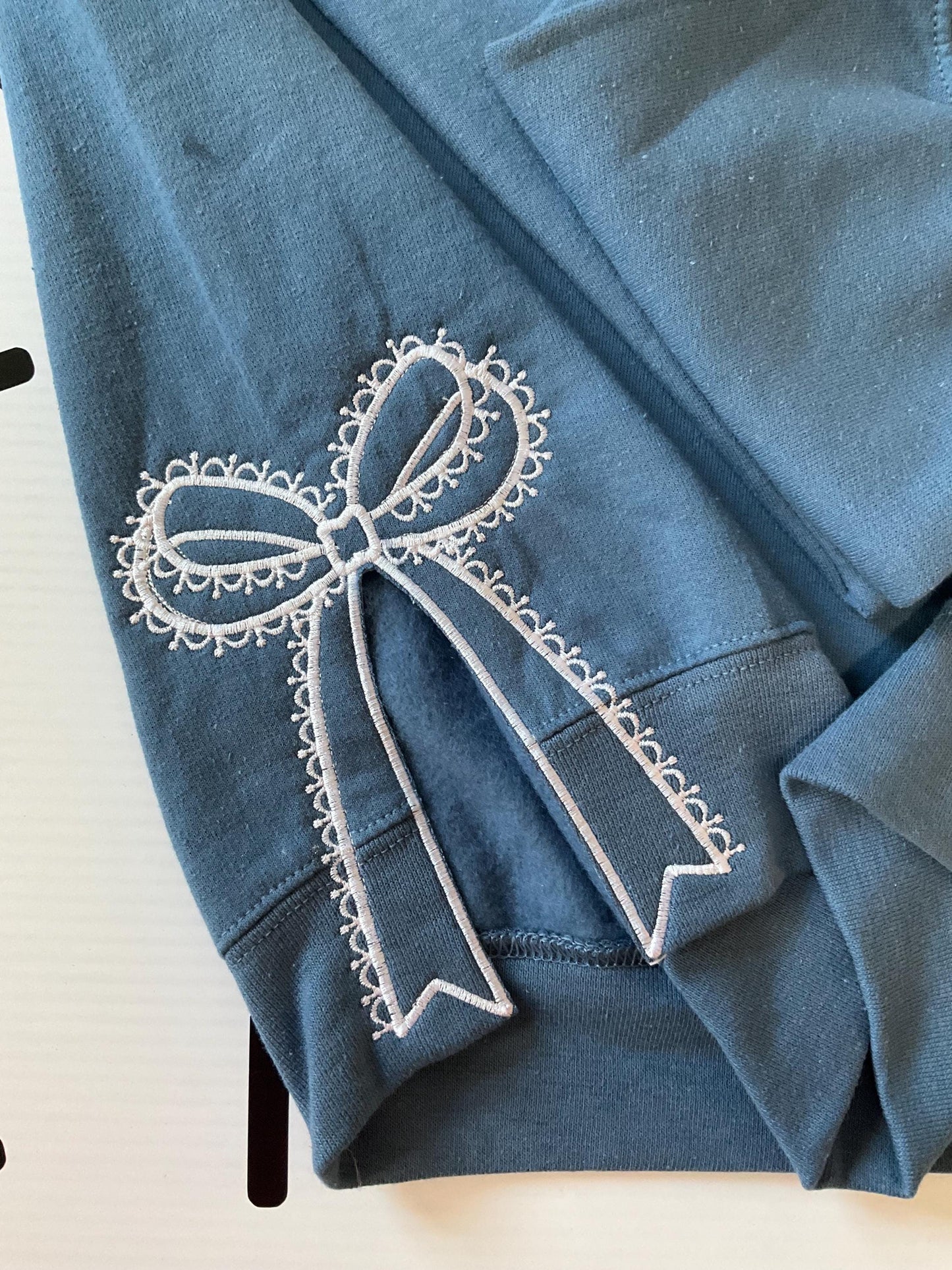 Embroidered Side Bow Sweatshirt: Classic Lace Design