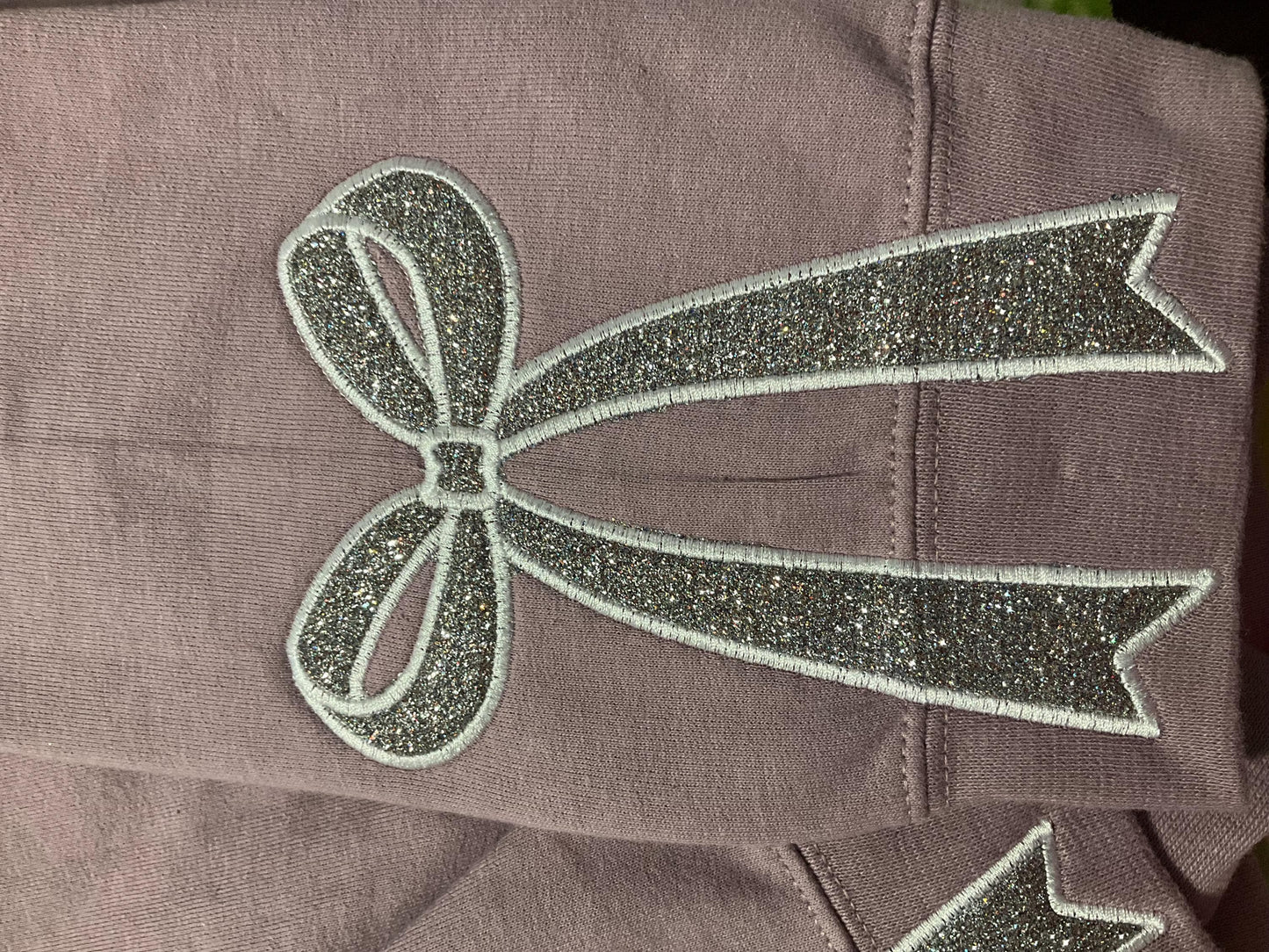 Embroidered Glitter Bow Sweatshirt: Side Appliqué Design